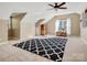 Large bonus room with high ceilings, neutral paint, and oversized rug at 12632 Landing Green Dr, Charlotte, NC 28277