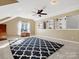 Bright bonus room with custom built-ins and neutral carpeting at 12632 Landing Green Dr, Charlotte, NC 28277