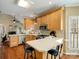 Well-lit kitchen featuring wood cabinets, stainless steel appliances, and an island with seating at 12632 Landing Green Dr, Charlotte, NC 28277