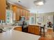 Spacious kitchen with wood cabinets, stainless steel appliances, and open layout to dining area at 12632 Landing Green Dr, Charlotte, NC 28277