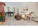 Comfortable living room featuring a piano, plush seating, and abundant natural light at 12632 Landing Green Dr, Charlotte, NC 28277
