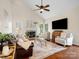 Cozy living room with fireplace, vaulted ceiling, and comfortable seating arrangement at 12632 Landing Green Dr, Charlotte, NC 28277