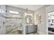 Spacious bathroom with a glass enclosed shower, gray vanity with square mirror, and decorative wall art at 13241 Cozy Ct, Charlotte, NC 28215