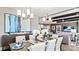 Open-concept dining room with decorative lighting, modern furnishings, and access to the living room at 13241 Cozy Ct, Charlotte, NC 28215