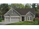 Charming single-Gathering home with a three car garage and stone accents at 13241 Cozy Ct, Charlotte, NC 28215