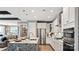 Modern kitchen featuring stainless steel appliances, white cabinets, and granite countertops at 13241 Cozy Ct, Charlotte, NC 28215