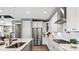 Modern kitchen featuring stainless steel appliances, white cabinets, and granite countertops at 13241 Cozy Ct, Charlotte, NC 28215