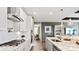 Modern kitchen featuring stainless steel appliances, white cabinets, and granite countertops at 13241 Cozy Ct, Charlotte, NC 28215