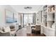 Well lit home office with a sleek desk, built-in shelving, and comfortable seating near a large window at 13241 Cozy Ct, Charlotte, NC 28215