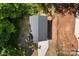 This is an aerial view of the home's roof and backyard, surrounded by trees and vegetation at 1411 Duhart Ave, Gastonia, NC 28054