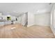 Spacious living room featuring hardwood floors, neutral paint, stainless appliances and abundant natural light through multiple windows at 1411 Duhart Ave, Gastonia, NC 28054