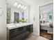 Modern bathroom with double vanity, neutral color palette and natural light at 1425 Downs Ave, Charlotte, NC 28205