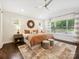 Bright bedroom with ceiling fan, accent rug, and lots of natural light at 1425 Downs Ave, Charlotte, NC 28205