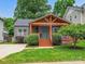 Charming single-story home features a welcoming porch and well-manicured lawn at 1425 Downs Ave, Charlotte, NC 28205