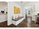 Hallway with a built-in bench, accent art, and lots of natural light at 1425 Downs Ave, Charlotte, NC 28205