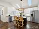 Bright kitchen featuring a center island, stainless steel appliances, and lots of natural light from skylights at 1425 Downs Ave, Charlotte, NC 28205