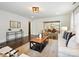 Bright living room with hardwood floors, modern furniture, and an open floor plan at 1425 Downs Ave, Charlotte, NC 28205