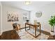 Bright office with natural light features wood floors, a desk, and a stylish wicker chair at 1425 Downs Ave, Charlotte, NC 28205