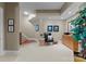 A finished basement featuring a staircase, sitting area, and a wooden cabinet at 143 Jeremy Point Pl, Mooresville, NC 28117