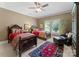 Bedroom with twin beds, a large area rug, an accent chair, and an accent wall at 143 Jeremy Point Pl, Mooresville, NC 28117