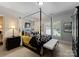 Traditional bedroom showcasing a stylish four-poster bed, neutral walls, and modern décor at 143 Jeremy Point Pl, Mooresville, NC 28117