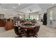 Entertaining game room with a poker table, bar, and a comfortable seating area at 143 Jeremy Point Pl, Mooresville, NC 28117