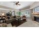 Spacious living room with neutral decor, fireplace, and multiple windows at 143 Jeremy Point Pl, Mooresville, NC 28117