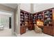 Beautiful office space featuring custom built-in wooden bookshelves and a high ceiling at 143 Jeremy Point Pl, Mooresville, NC 28117