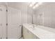Bathroom featuring a large mirror, patterned wallpaper, and a modern vanity at 15038 Jockeys Ridge Dr, Charlotte, NC 28277