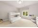 Bright bedroom featuring a built-in bunk bed, window, and a cozy beanbag chair at 15038 Jockeys Ridge Dr, Charlotte, NC 28277