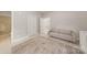 Bedroom featuring two doors, a small sofa and a neutral color palette at 15038 Jockeys Ridge Dr, Charlotte, NC 28277