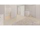 Bright bedroom with neutral tones, an open doorway, and white furnishings at 15038 Jockeys Ridge Dr, Charlotte, NC 28277