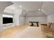 Spacious game room featuring a pool table, large TV, and hardwood floors at 15038 Jockeys Ridge Dr, Charlotte, NC 28277