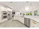 Open kitchen featuring stainless steel appliances, a breakfast bar, and modern countertops at 15038 Jockeys Ridge Dr, Charlotte, NC 28277