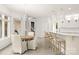 Kitchen and dining area with ample counter space, bar seating, and dining table at 15038 Jockeys Ridge Dr, Charlotte, NC 28277