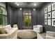 Chic living room featuring large windows, neutral-toned furniture, modern light fixture, and contemporary decor at 15038 Jockeys Ridge Dr, Charlotte, NC 28277
