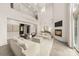 Spacious living room with a fireplace, high ceilings, neutral decor, modern light fixtures, and open layout at 15038 Jockeys Ridge Dr, Charlotte, NC 28277