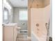 Bathroom features a shower-tub combo and updated vanity at 1690 Montevista Dr, Shelby, NC 28150