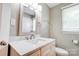 This bathroom features a decorative mirror, an updated vanity, and neutral paint at 1690 Montevista Dr, Shelby, NC 28150