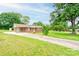 Well-maintained brick home featuring a carport, long driveway, and a lush green lawn at 1690 Montevista Dr, Shelby, NC 28150