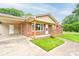 Charming brick home with great curb appeal and manicured lawn and driveway with a carport at 1690 Montevista Dr, Shelby, NC 28150