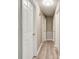 Hallway with fresh neutral paint, updated lighting, and new flooring at 1690 Montevista Dr, Shelby, NC 28150