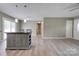 Open concept layout from kitchen to living room with a central island and modern finishes at 1690 Montevista Dr, Shelby, NC 28150