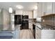 Modern kitchen featuring white cabinets, stainless appliances, and granite countertops at 1690 Montevista Dr, Shelby, NC 28150