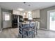 Contemporary kitchen with white cabinetry, island seating, and stainless steel appliances at 1690 Montevista Dr, Shelby, NC 28150