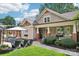 Outdoor space with a swimming pool, lounge chairs and a charming covered porch, ideal for relaxation at 1701 Dearmon Dr, Charlotte, NC 28205