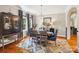A stylish dining room with an oval table, elegant chandelier, and custom window treatments at 1701 Dearmon Dr, Charlotte, NC 28205