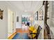 Hallway with hardwood floors, artwork, and a view into the salon room at 1701 Dearmon Dr, Charlotte, NC 28205