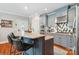 Stylish kitchen island features a granite countertop, seating, and stainless steel appliances at 1701 Dearmon Dr, Charlotte, NC 28205