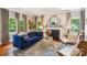 A well-lit living room featuring a fireplace, plush seating, hardwood floors, and elegant decor at 1701 Dearmon Dr, Charlotte, NC 28205